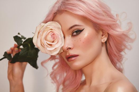 Soft-Girl Style with Trend Pink Flying Hair, Fashion Make-up. Blond Woman Face with Freckles, Blush Rouge, Rose Flowers