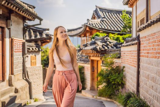 Young woman tourist in Bukchon Hanok Village is one of the famous place for Korean traditional houses have been preserved. Travel to Korea Concept