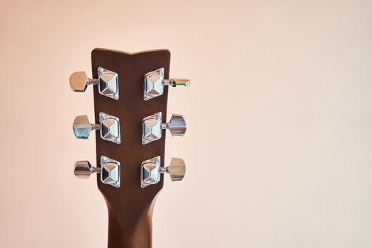 Acoustic guitar headboard with pegs. Guitar fretboard.