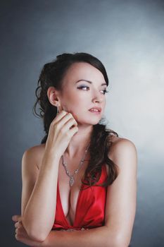 ambitious beautiful woman in a red dress.isolated on dark