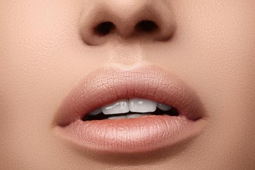 Natural fashion lipstick. Close-up beautiful sexy lips. Full lips with lip makeup. Filler Injections, Plastic Surgery