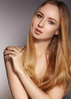Fashion long hair. Beautiful blond girl. Healthy straight shiny hair style. Beauty woman model. Smooth hairstyle