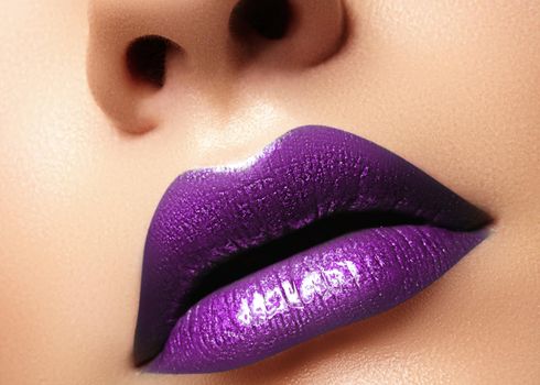 Glamour purple Gloss Lips with sensuality gesture. Sexy style, closeup macro shot female Lip Make-up. Sensuality mouth