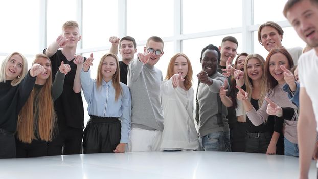 multinational group of young people pointing at you