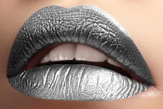 Closeup Lips with frost silver color Makeup. Fashion Celebrate Make-up for New Year. Shiny Christmas Glitter Lip style