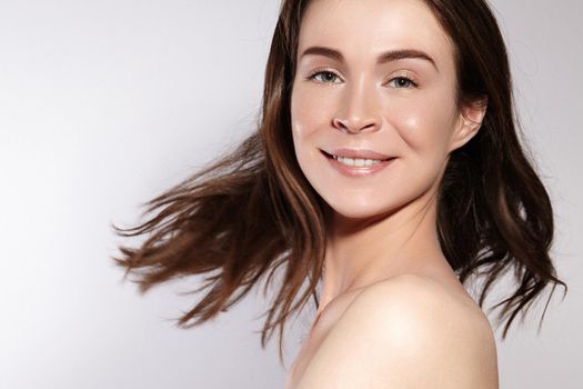Beautiful Smiling Woman with Clean Skin, Natural Make-Up. Joyfull and Happiness. Emotional Female Face. Health, Wellness