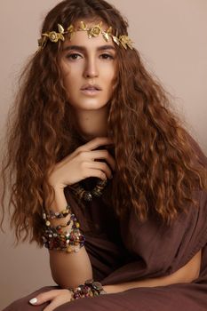 Beautiful Woman. Curly Long Hair. Fashion Model. Healthy Wavy Hairstyle. Accessories. Autumn Wreath, Gold Floral Crown