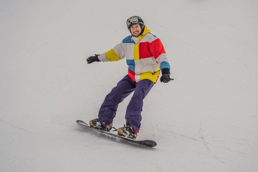 Male snowboarder at a ski resort in winter