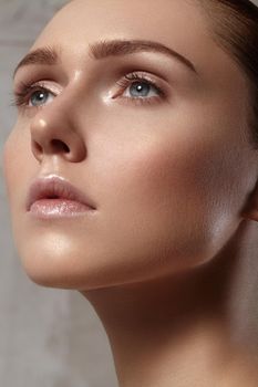 Beautiful young woman with perfect clean shiny skin, natural fashion makeup. Close-up woman, fresh spa look
