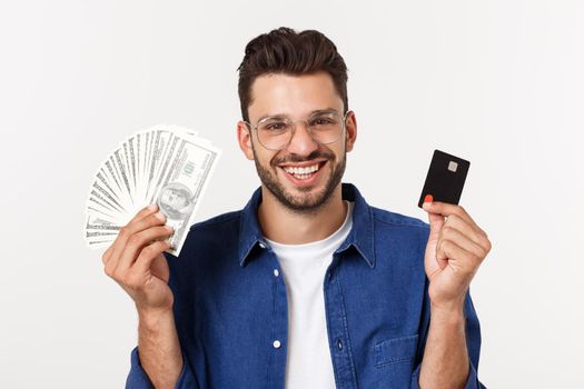 Portrait of a frinedly bearded man holding credit card and showing cash isolated over white background