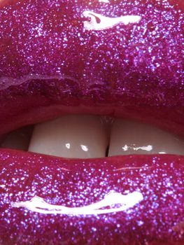 Glamour magenta gloss lip make-up. Fashion makeup beauty shot. Close-up female sexy full lips with celebrate pink gloss