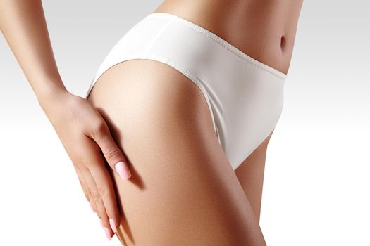 Spa, wellness. Healthy slim body. Beautiful sexy hips. Fitness or plastic surgery. Perfect buttocks without cellulite