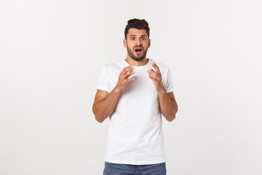 Close up portrait of disappointed stressed bearded young man in shirt over white background.