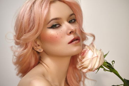 Beautiful woman with pink hair and fashion make-up. Blonde Female Model with perfect Fresh Clean Skin, Blush Rouge