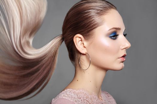 Girl with Ponytail Hairstyle. Shiny Straight Hair, Fashion Makeup on Model Face. Woman with Healthy Skin, Party Make-up