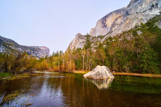 Boulder in Mirror Lake next to Half Dome at Yosemite