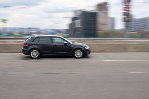 Ukraine, Kyiv - 20 April 2021: Black Audi A3 car moving on the street. Editorial