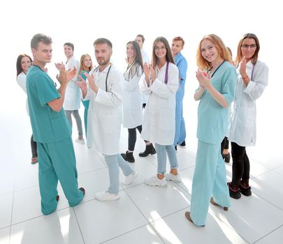 team of diverse doctors applauding their joint success