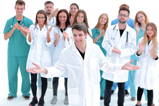team of medical professionals applauding their leader