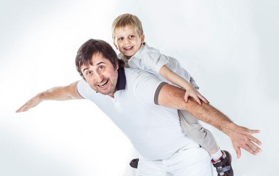 concept of children's happiness: happy father playing with his five year old son