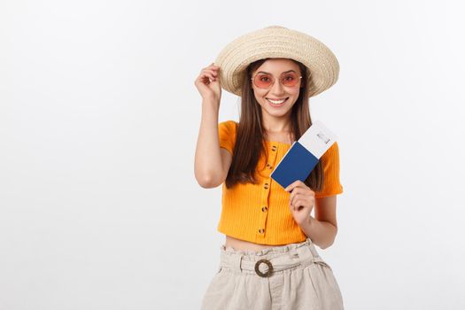Portrait of happy tourist woman holding passport on holiday on white background.
