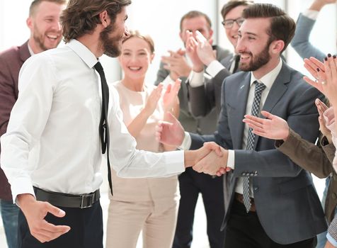 business team congratulating each other on the victory