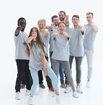 happy young people pointing somewhere up. photo with copy space