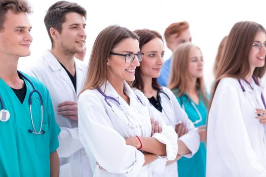 group of young doctors are looking ahead with confidence .