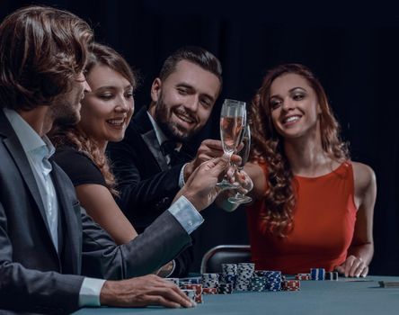 friends drinking and celebrating a gambling night