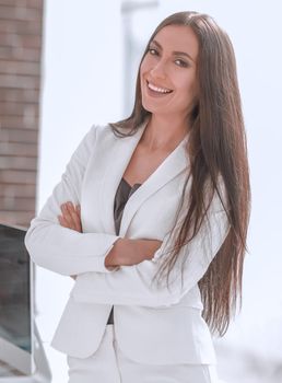 elegant business woman in a white business suit