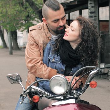 loving couple riding a motorcycle . love story