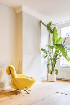 Stylish yellow armchair with a