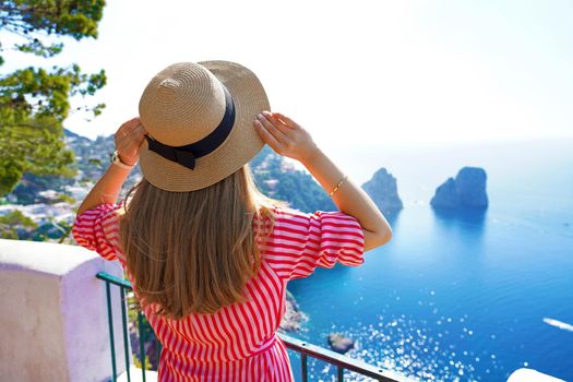 Young beautiful woman enjoying Italian landscape on sunny day, Capri, Italy