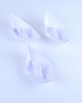 Paper boat on white background