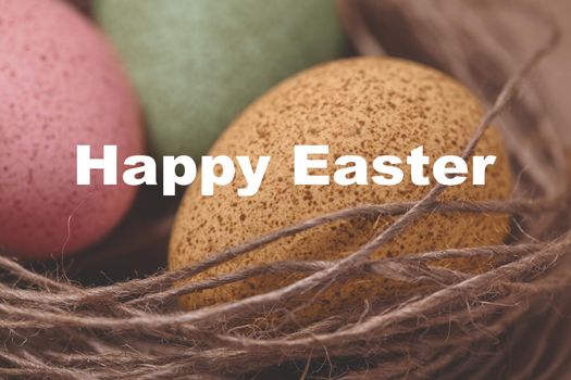 Happy Easter Card. Close-up photo Easter Decoration with Nest with Bright Colors Eggs