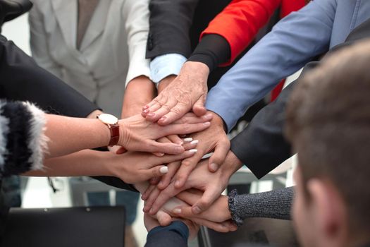 Group of business people joining hand together for making a deal