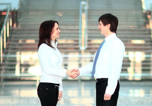 businesswoman and client handshaking