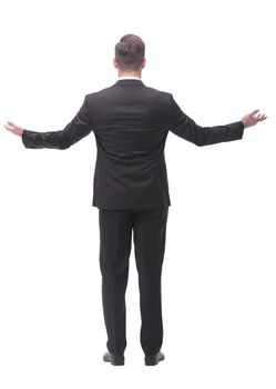 rear view . friendly businessman standing in front of blank white screen