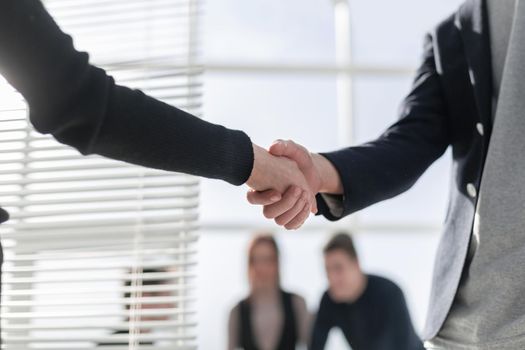 Businessmen making handshake in the city - business etiquette, c