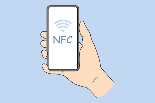 Person holding cellphone with NFC on screen