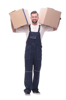 in full growth. a smiling man with cardboard boxes on his shoulders