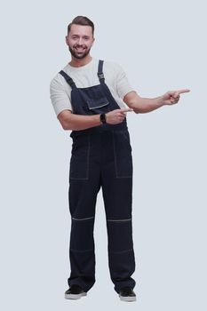 smiling man in overalls pointing to a copy of the space