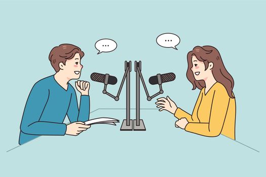 Diverse people talk in microphones at radio