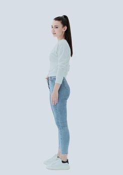 side view. stylish young woman in jeans and white blouse