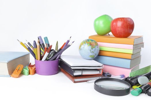 variety of colorful school supplies on a white background