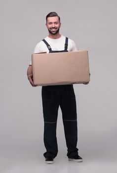 man in workwear with cardboard box isolated on white background