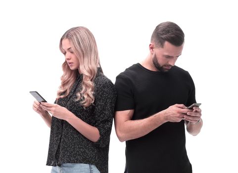 loving young couple reading e-mails on their smartphone