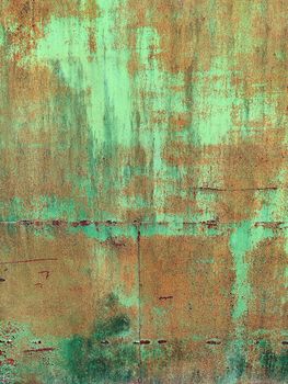 Corroded metal background. Rusty metal background with streaks of rust. Rust stains. Rystycorrosion.