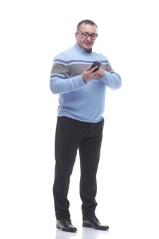 in full growth. attractive mature man with smartphone