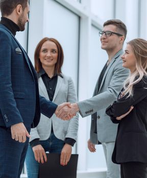 business colleagues greeting each other with a handshake